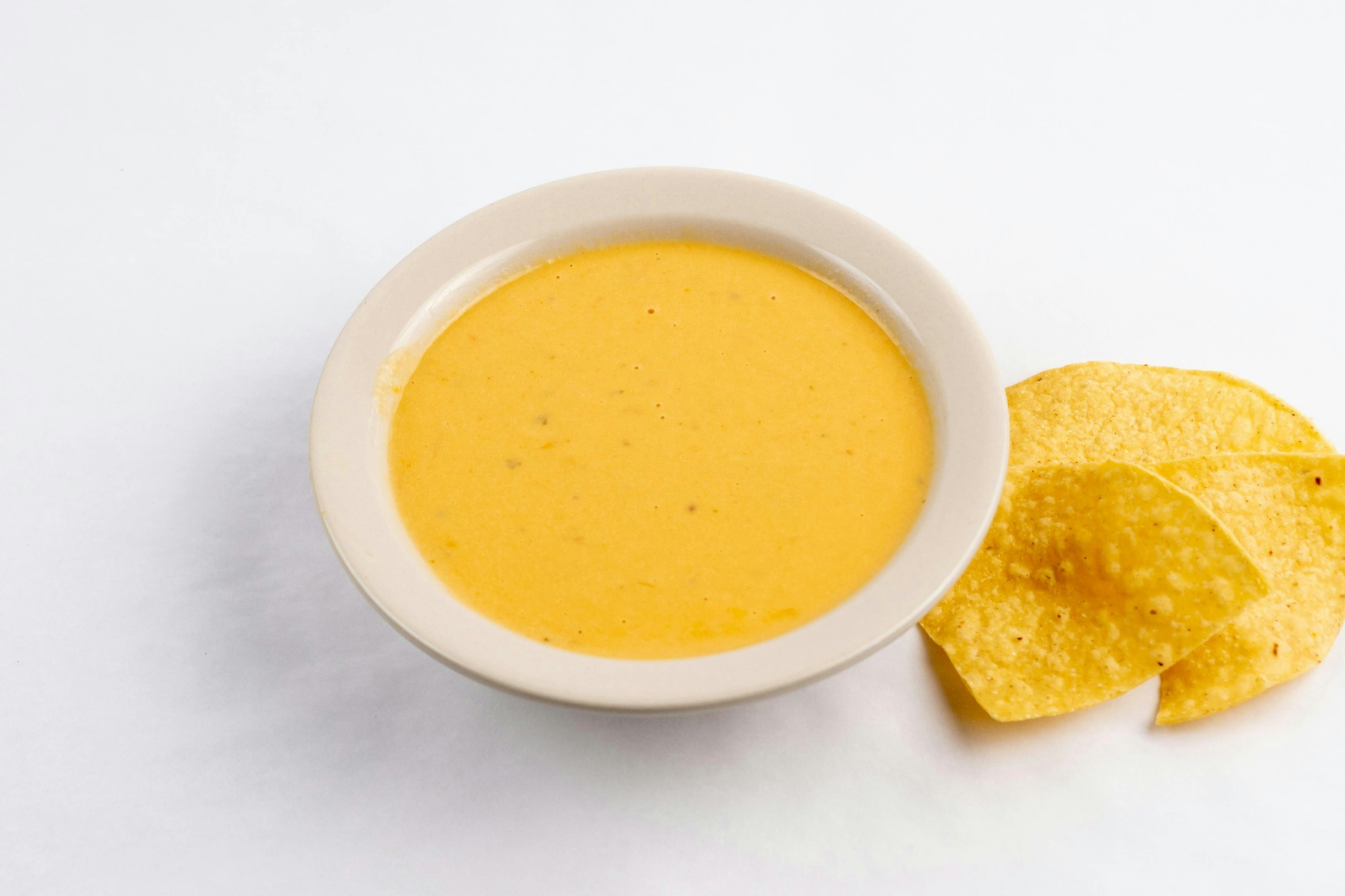 Creamy golden spread in a bowl ready for dipping
